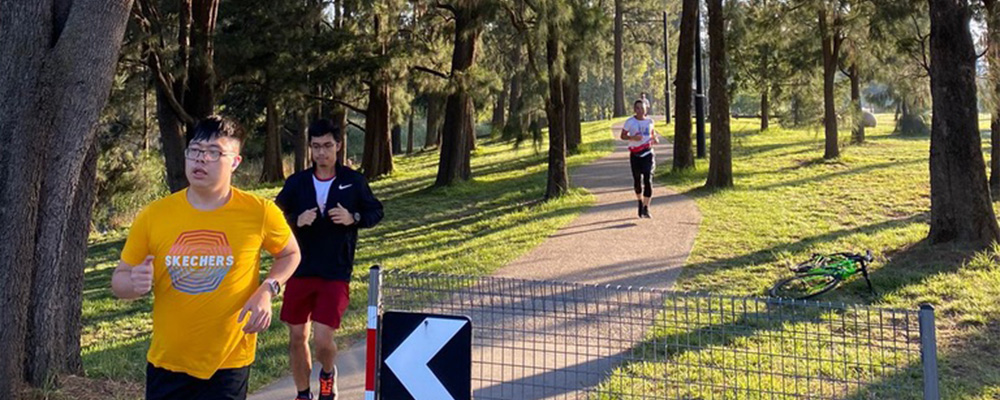Trevin running along a path as part of an event.