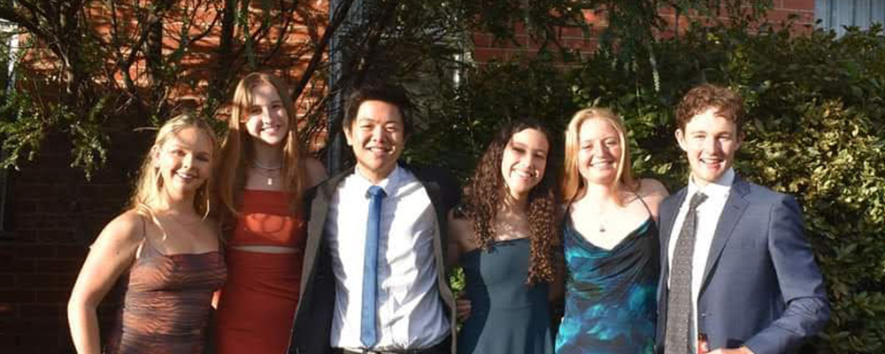 Bo poses with a group of other Tuckwell Scholars in formal wear.