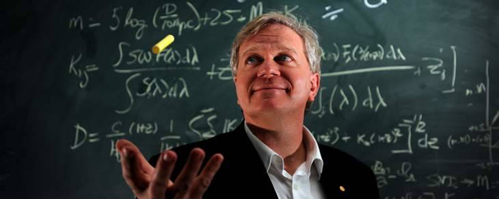 Brian Schmidt in front of calculations.