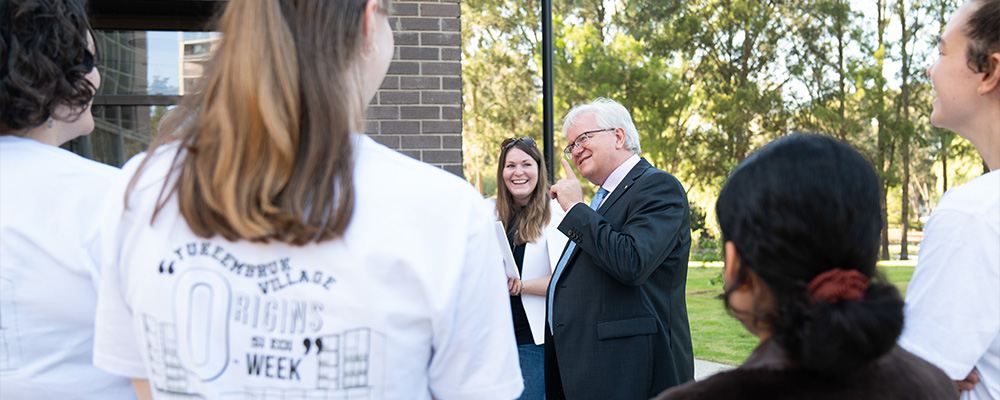 Brian Schmidt talks with students at the official opening of Yukeembruk ANU student residence.